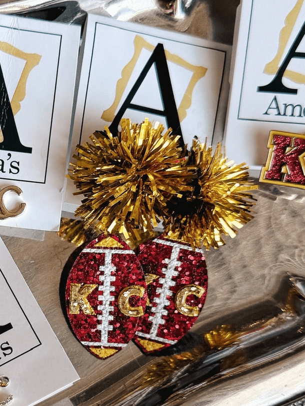 Amelia’s Custom KC Pom Pom Earrings - Amelia's Boutique